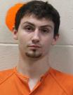 Booking photo of Corey Marc Raymond