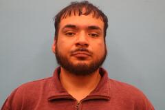 Booking photo of Albert Deluna